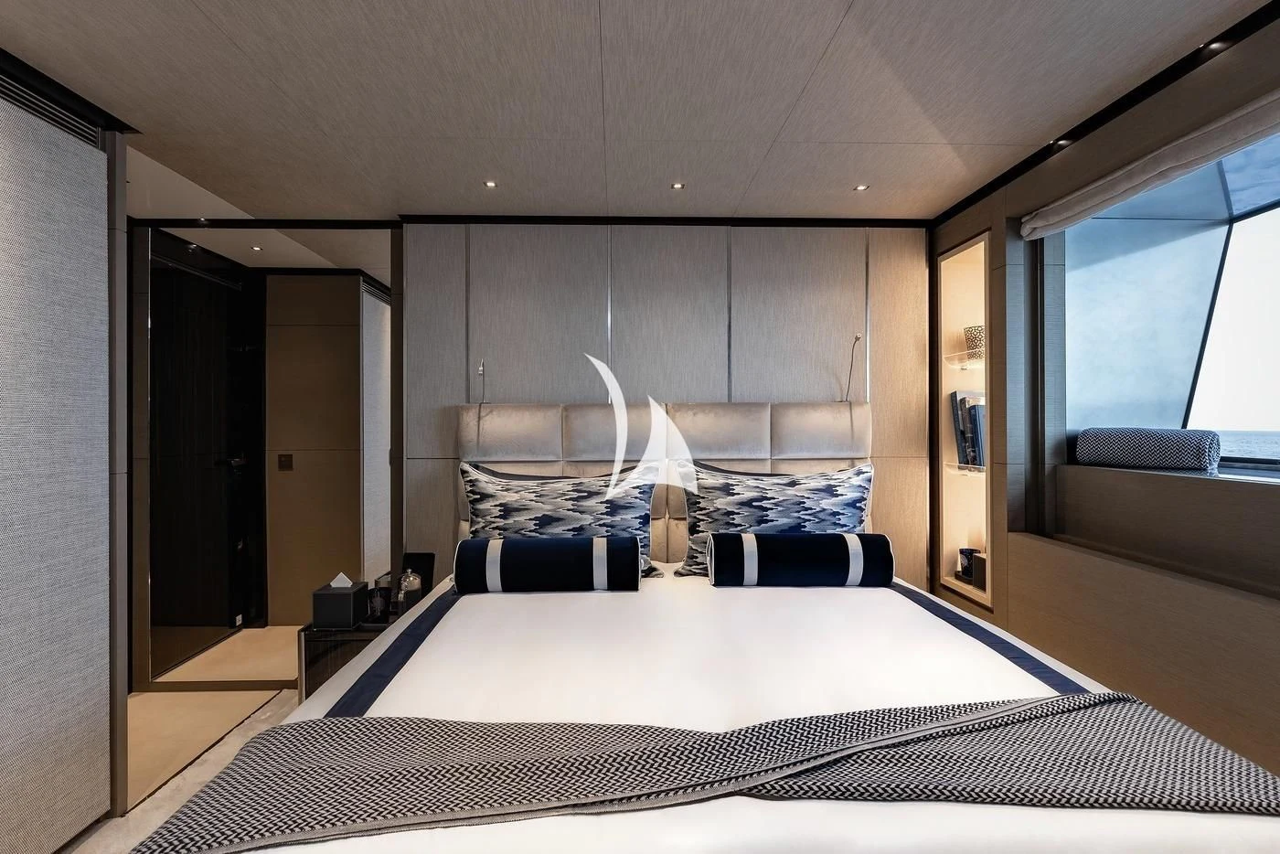 a bedroom with a large bed aboard LEMON TREE Yacht for Charter