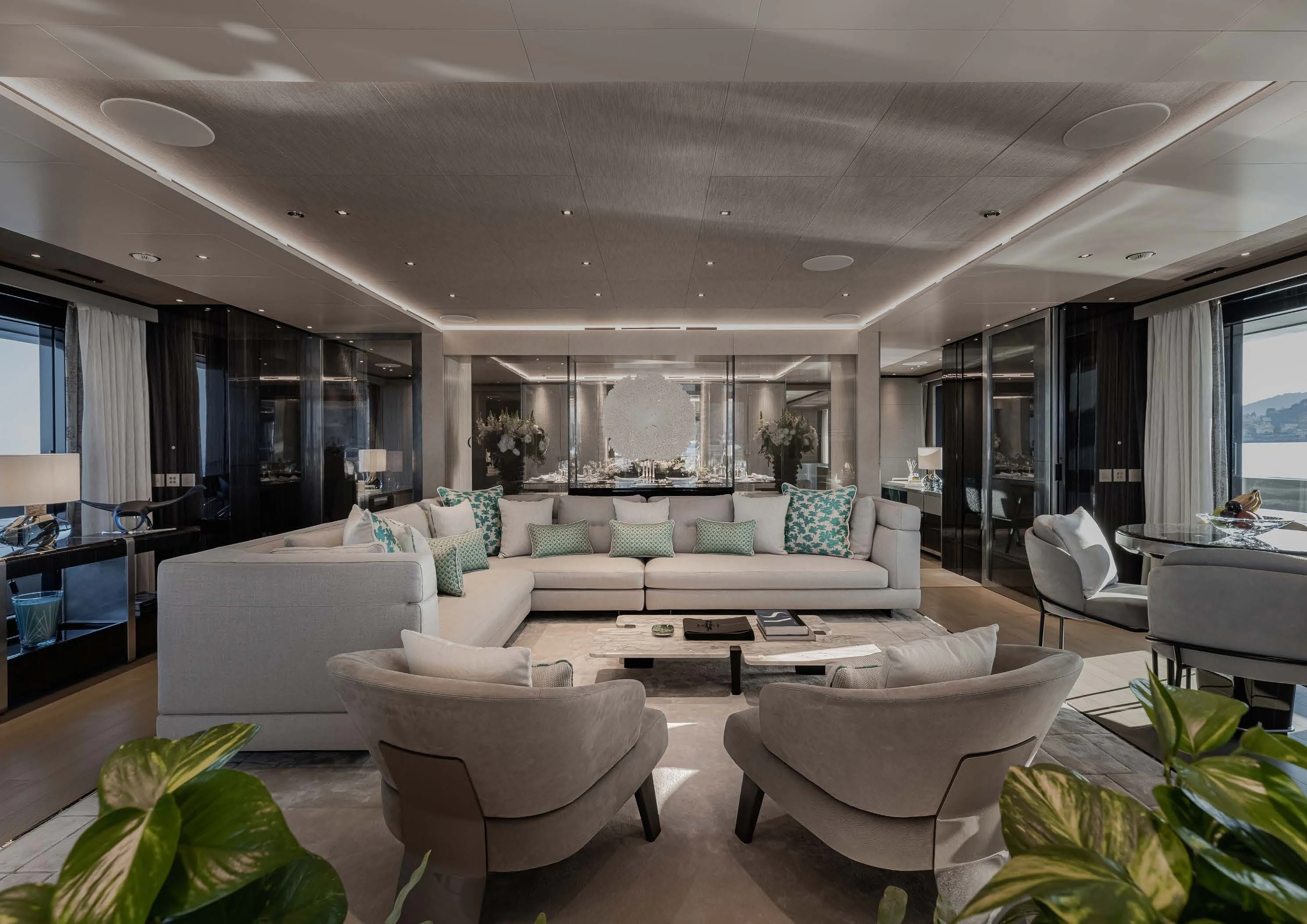 a living room with white furniture aboard LEMON TREE Yacht for Charter