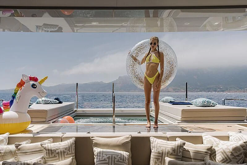 a person standing on a bed aboard LEMON TREE Yacht for Charter