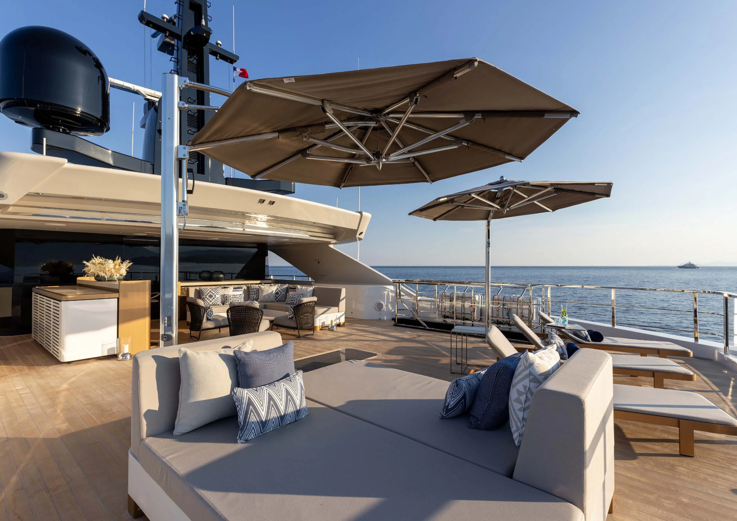 a lounge area with a large umbrella aboard LEMON TREE Yacht for Charter
