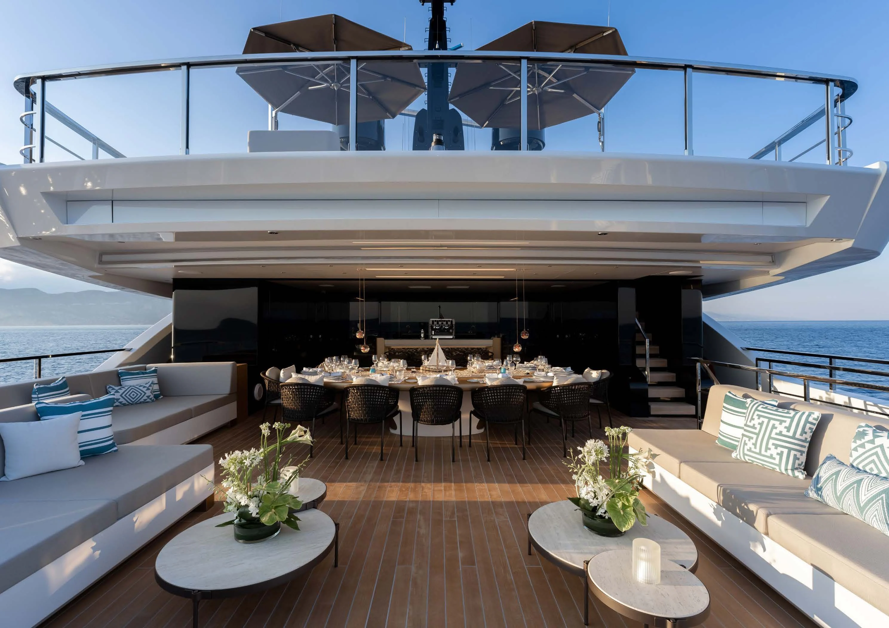 a room with a wood floor and a large white bridge over water aboard LEMON TREE Yacht for Charter