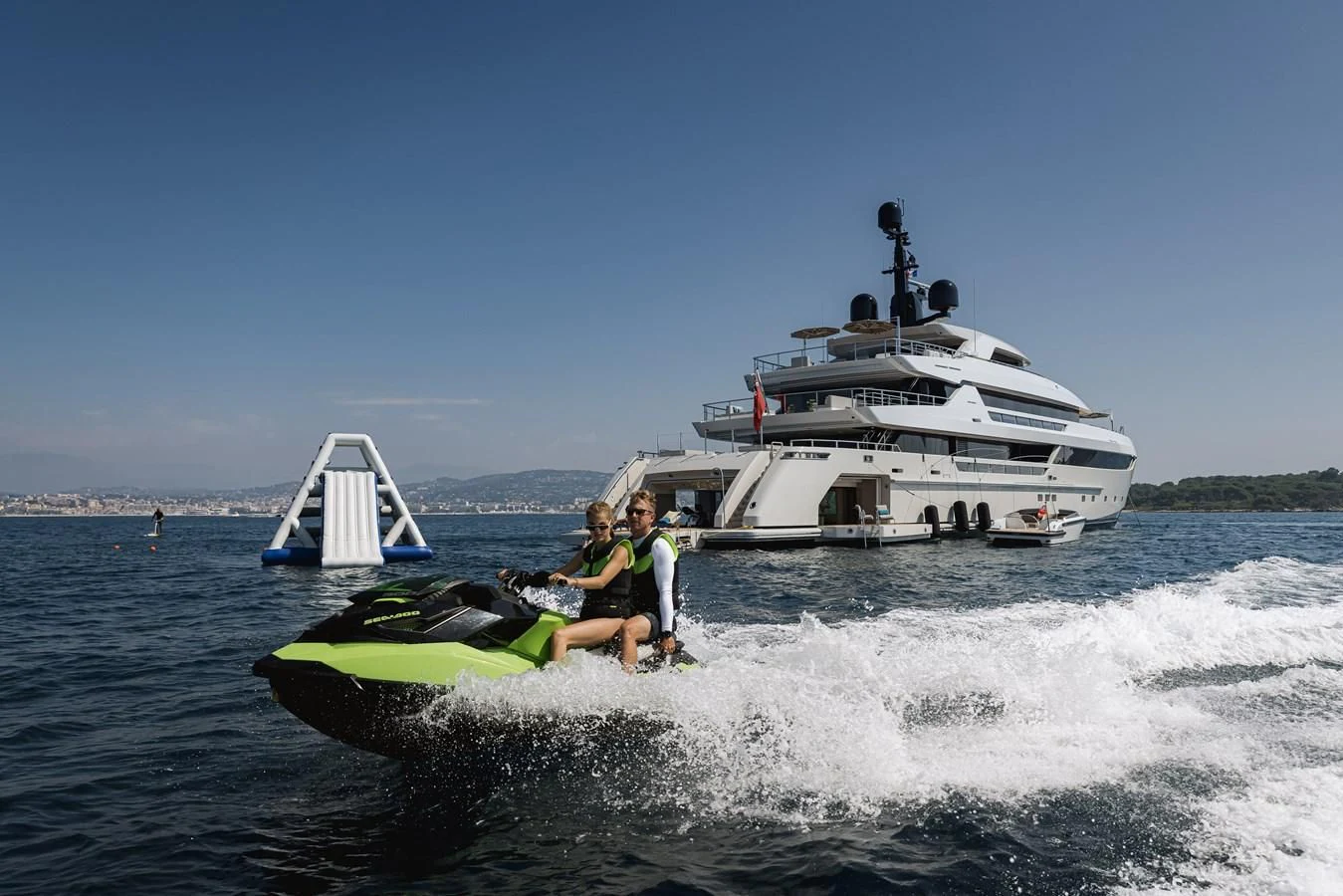 a couple people on a speed boat in the water aboard LEMON TREE Yacht for Charter