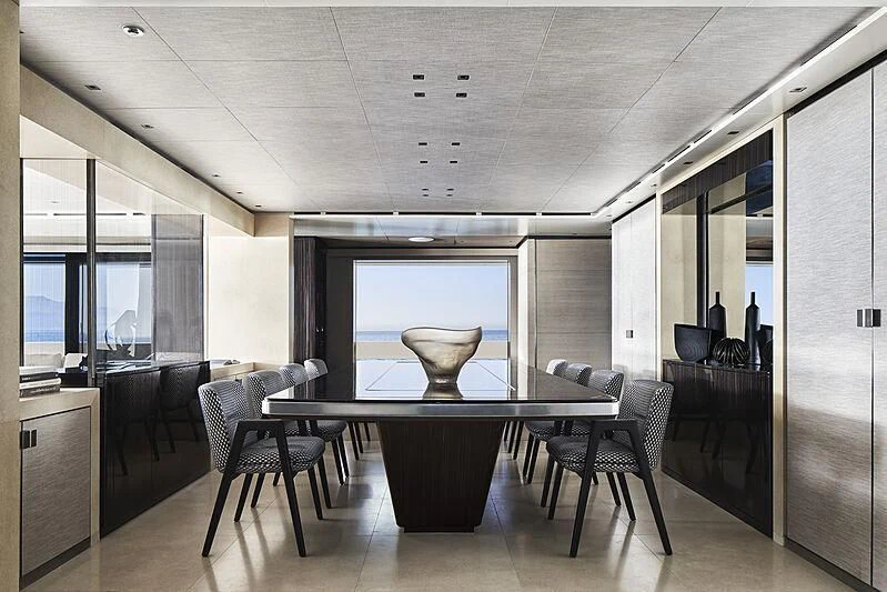 a room with a table and chairs aboard LEMON TREE Yacht for Charter