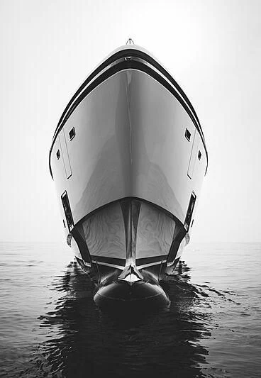 a black and white photo of a white boat on water aboard LEMON TREE Yacht for Charter