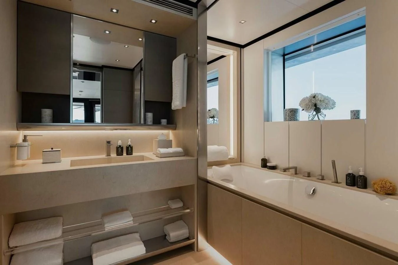 a bathroom with a large mirror aboard LEMON TREE Yacht for Charter