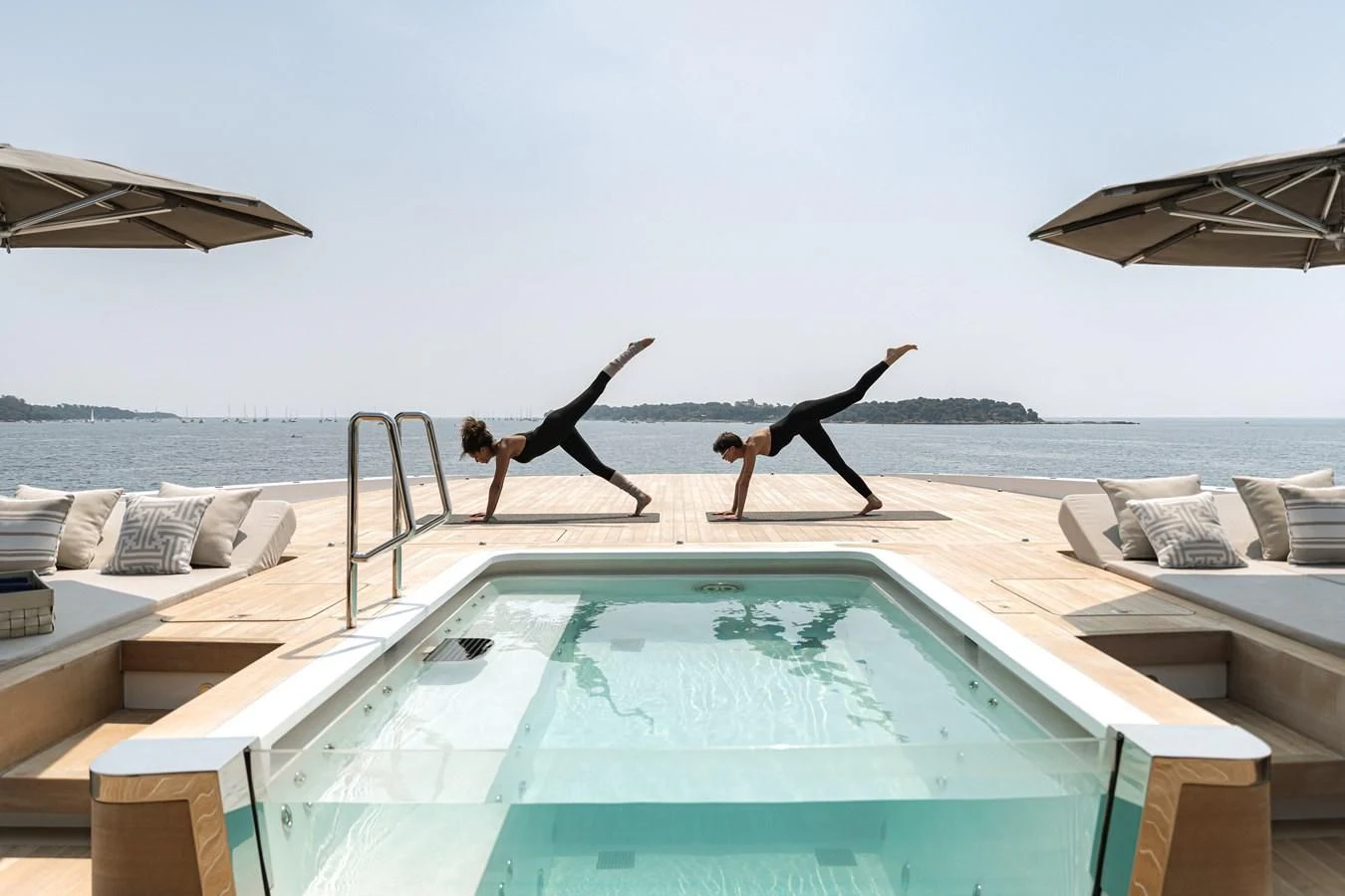 a group of people jumping into a pool aboard LEMON TREE Yacht for Charter