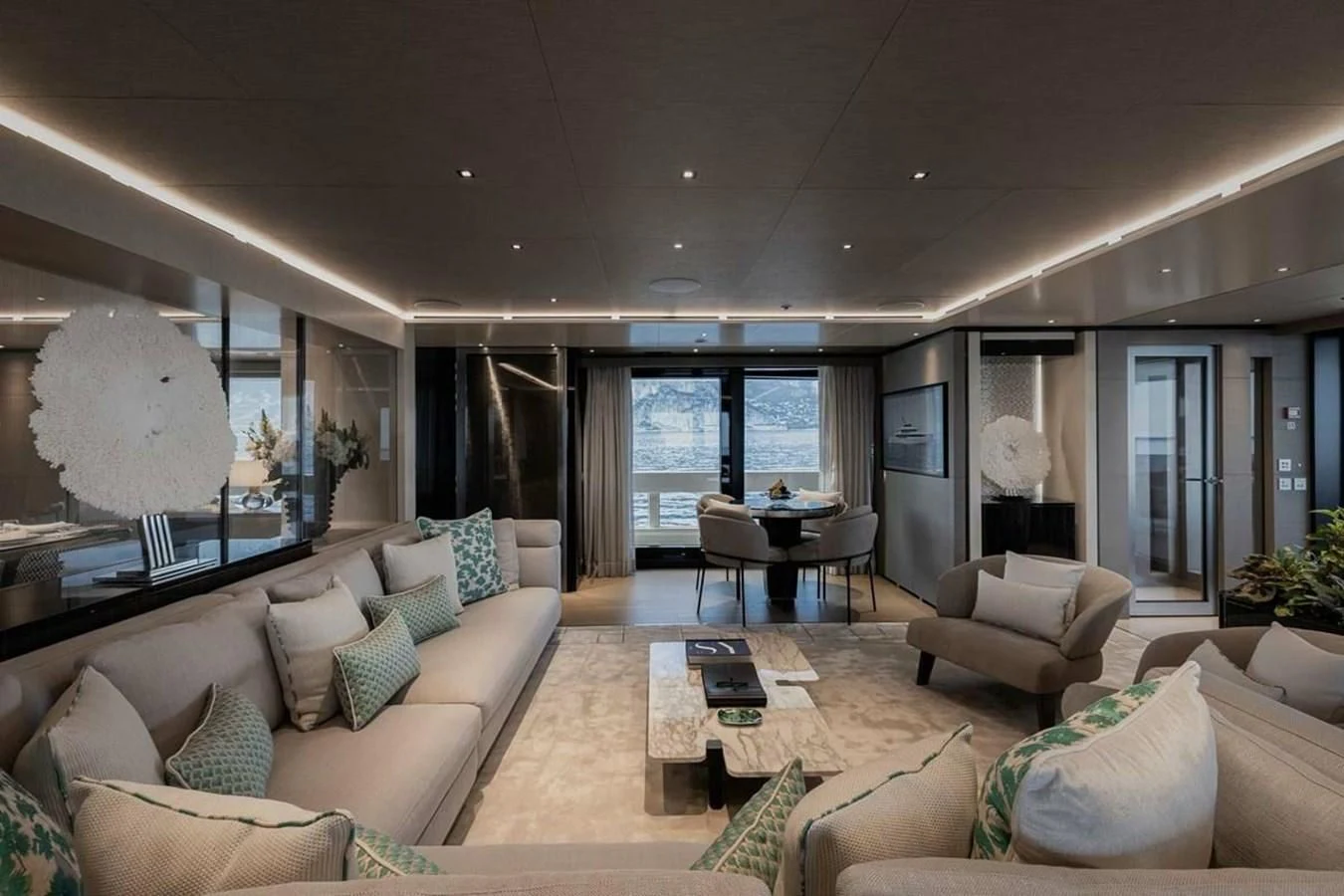 a living room with a large window aboard LEMON TREE Yacht for Charter