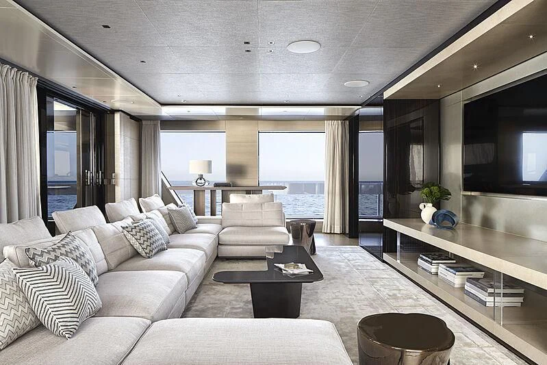 a living room with a large window aboard LEMON TREE Yacht for Charter