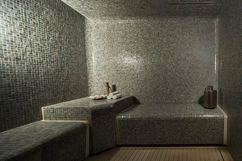 a room with a bed and a table aboard LEMON TREE Yacht for Charter