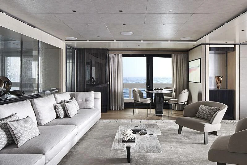 a living room with a large window aboard LEMON TREE Yacht for Charter