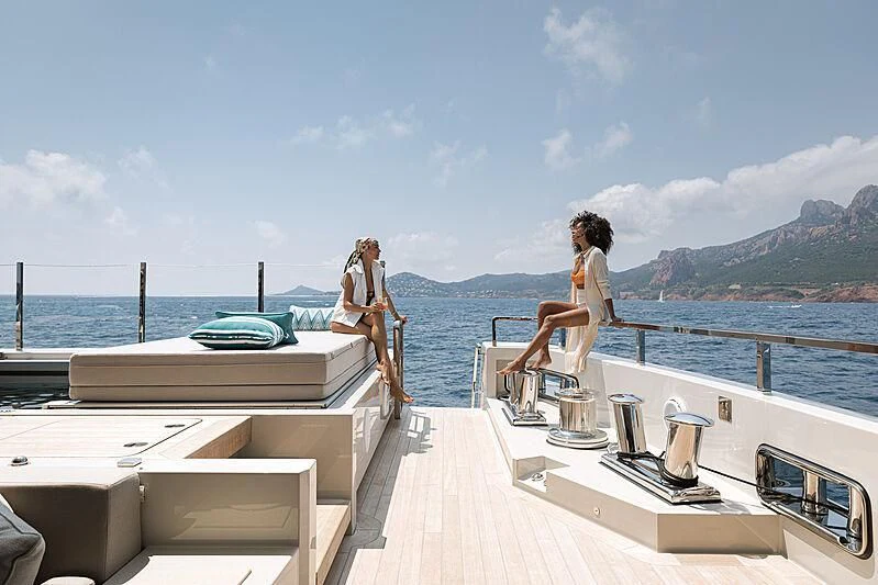 a couple of women on a deck aboard LEMON TREE Yacht for Charter