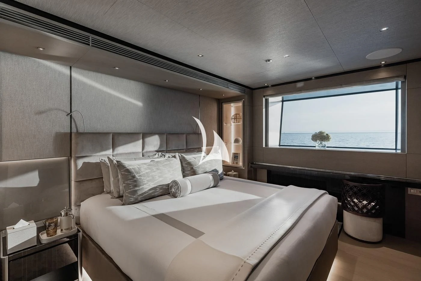 a bedroom with a large mirror aboard LEMON TREE Yacht for Charter