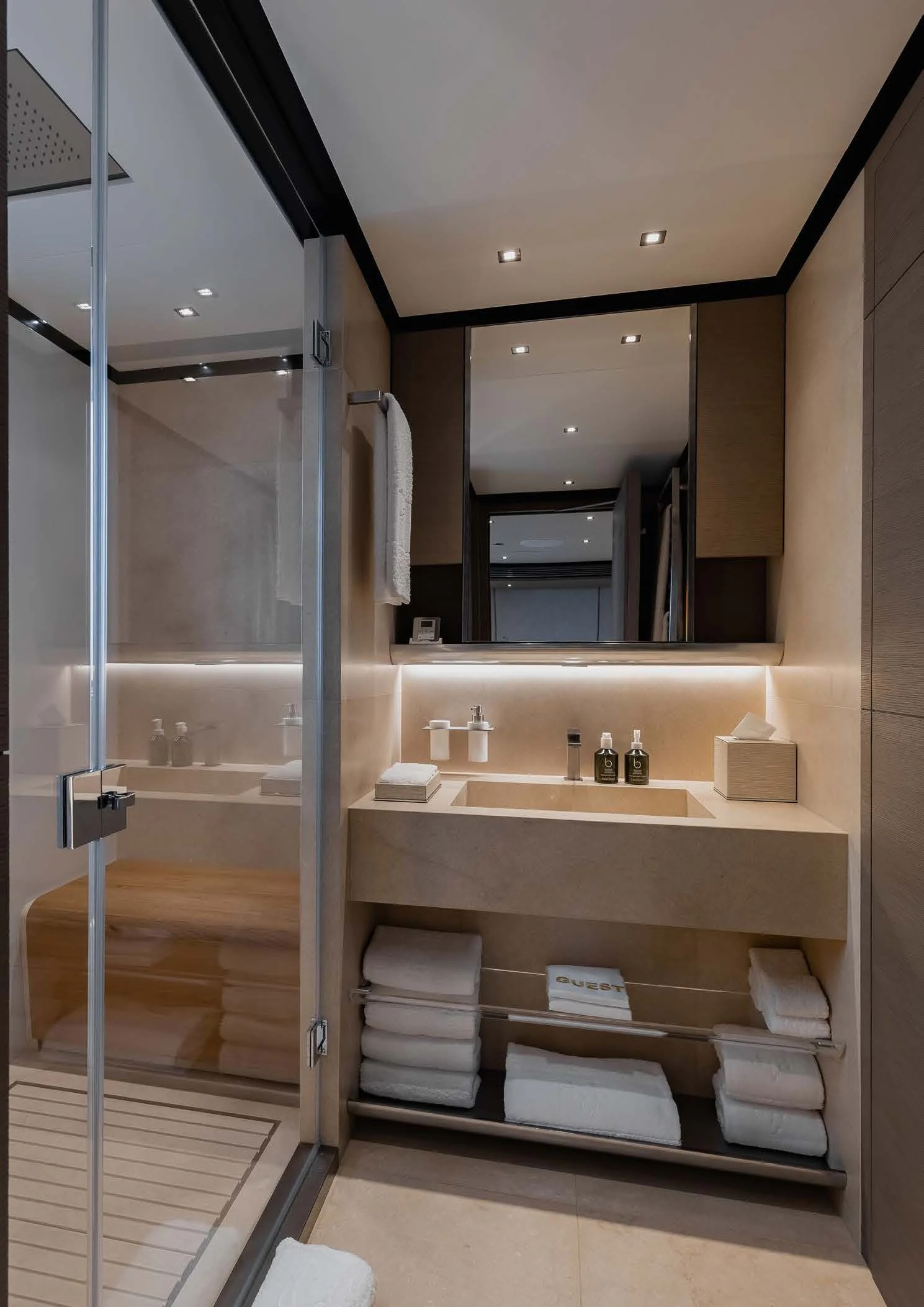 a bathroom with a glass shower aboard LEMON TREE Yacht for Charter