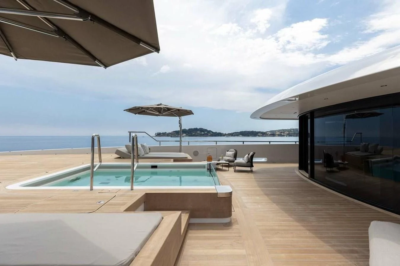 a pool on a deck by the ocean aboard LEMON TREE Yacht for Charter