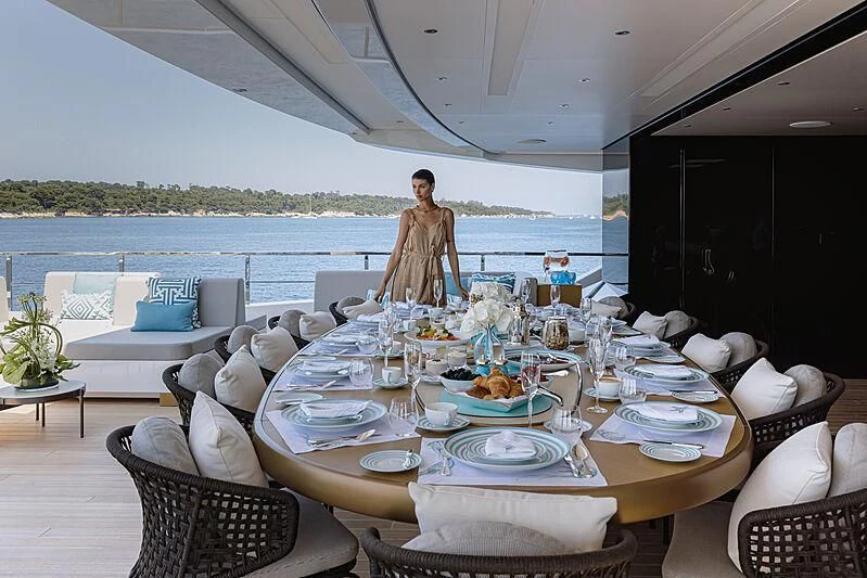 a table set for a dinner on a boat aboard LEMON TREE Yacht for Charter
