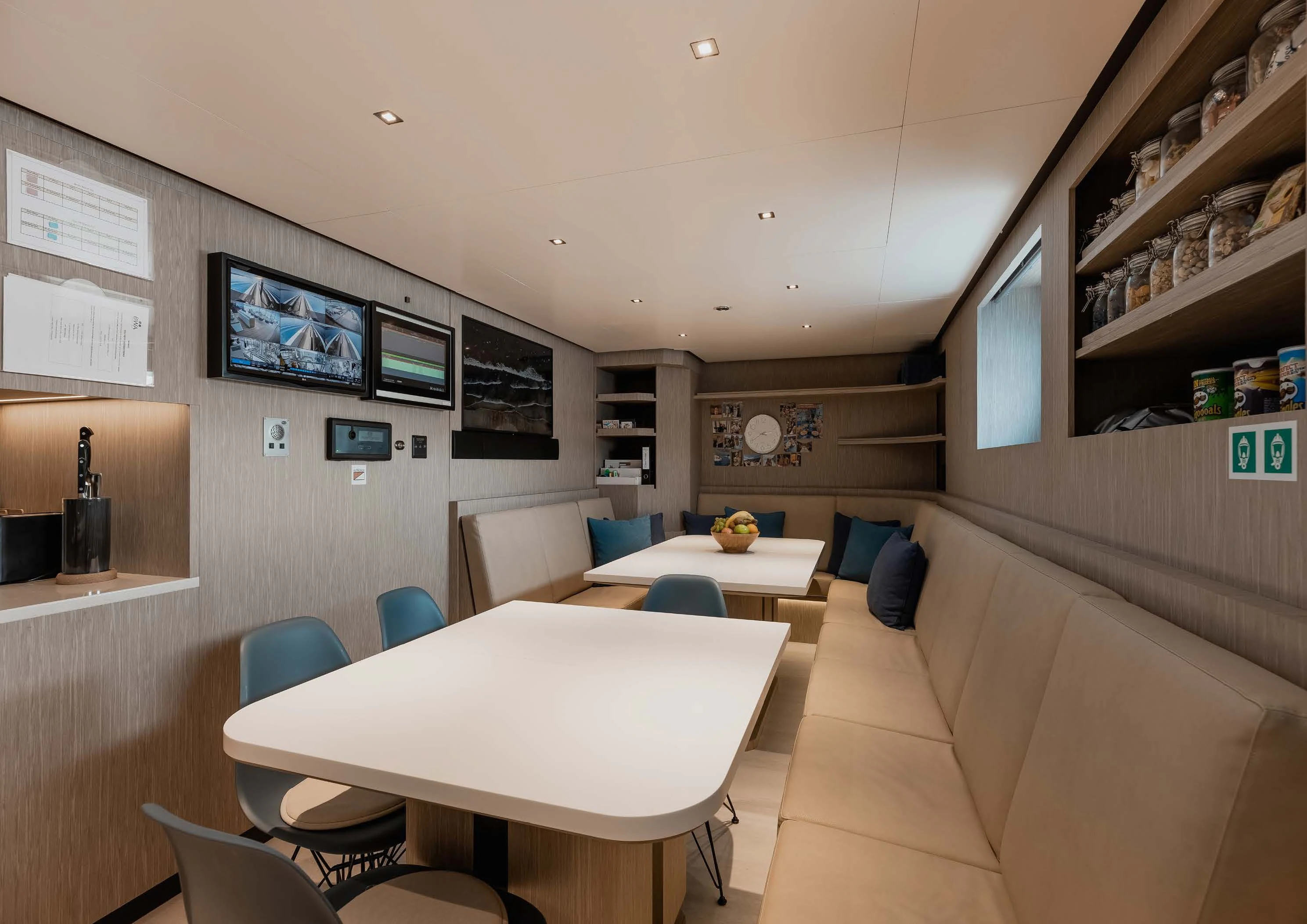 a room with a table and chairs aboard LEMON TREE Yacht for Charter