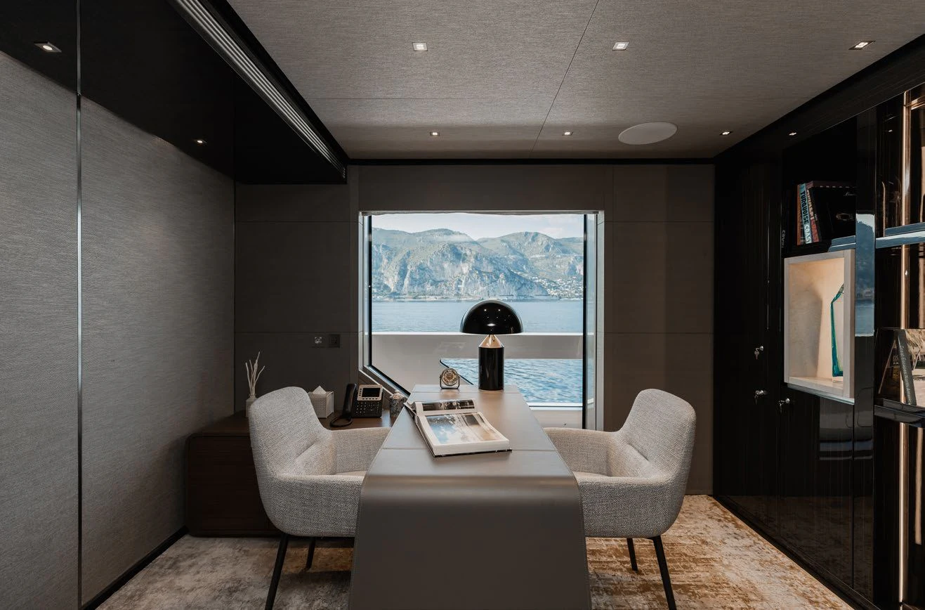 a living room with a large window aboard LEMON TREE Yacht for Charter