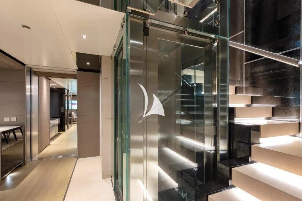 a large room with glass doors aboard LEMON TREE Yacht for Charter