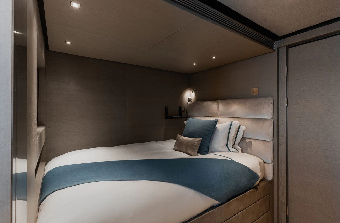 a bed in a room aboard LEMON TREE Yacht for Charter