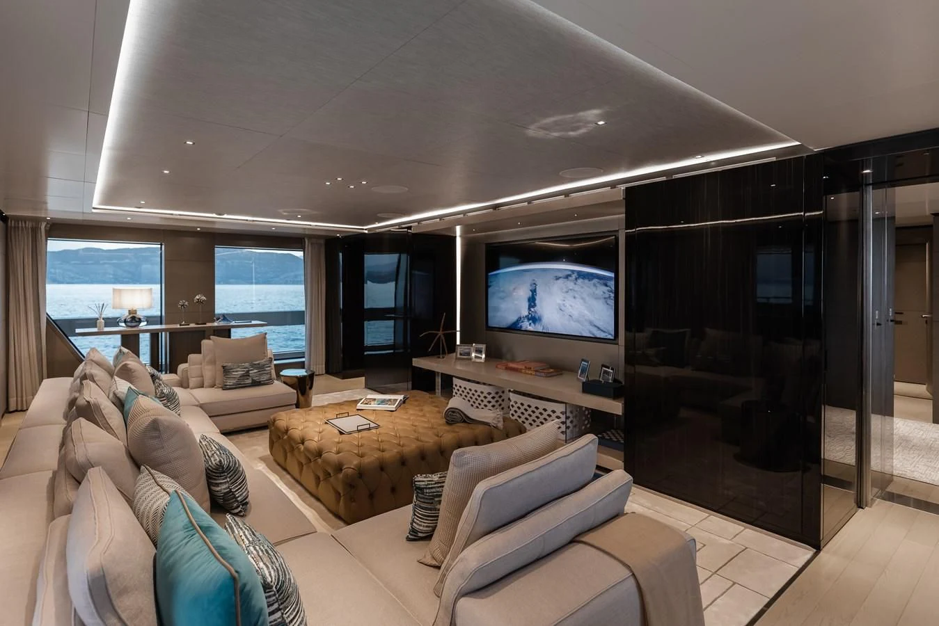 a living room with a large screen aboard LEMON TREE Yacht for Charter