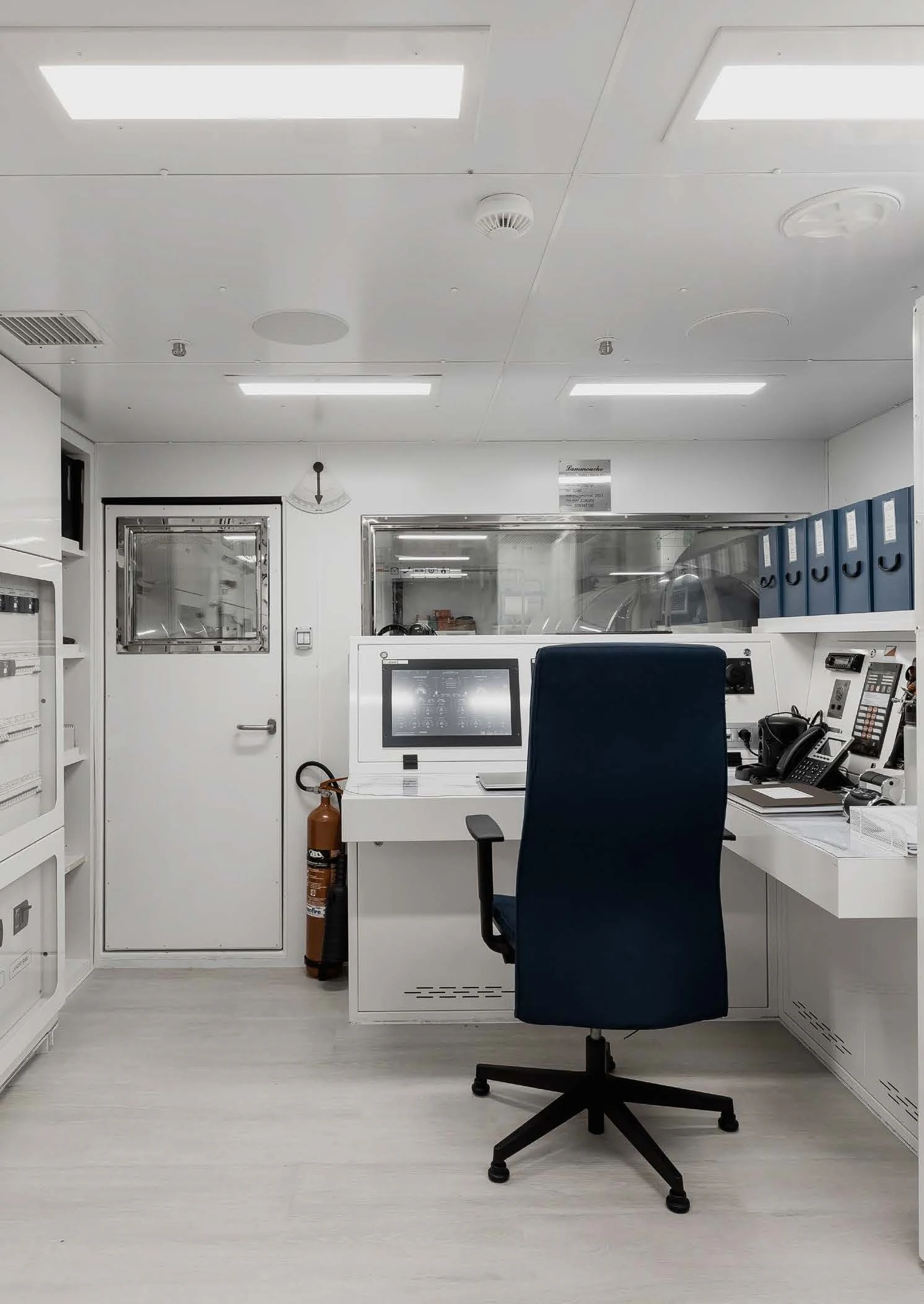 an office with a desk and computer aboard LEMON TREE Yacht for Charter