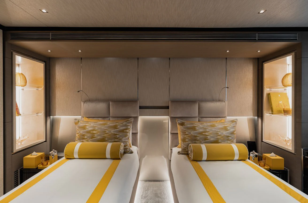a room with a bed and a desk aboard LEMON TREE Yacht for Charter