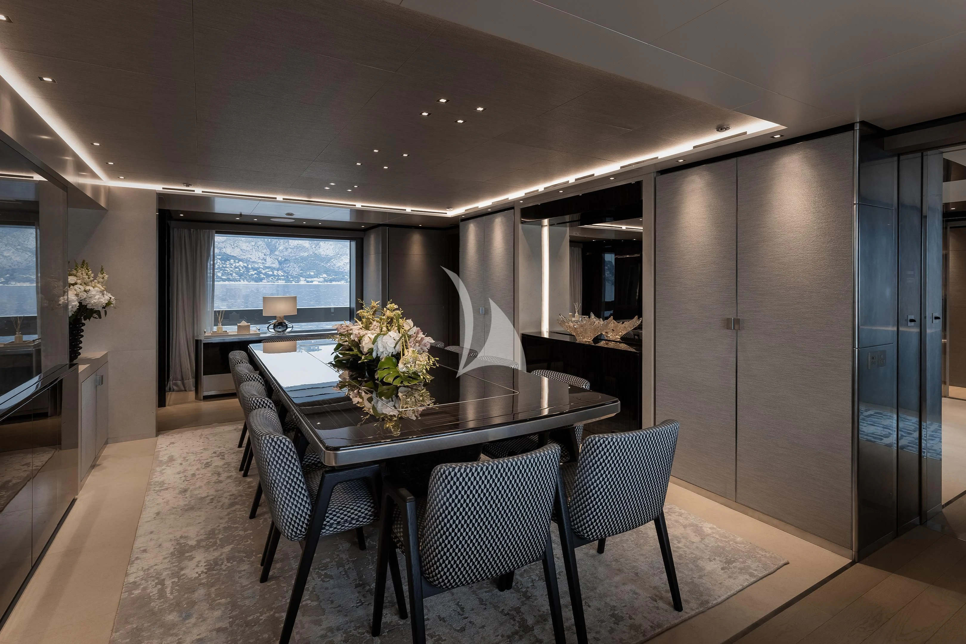a large kitchen with a dining table aboard LEMON TREE Yacht for Charter