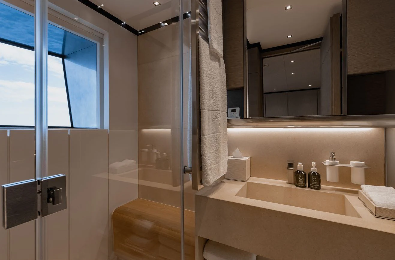 a bathroom with a marble counter aboard LEMON TREE Yacht for Charter
