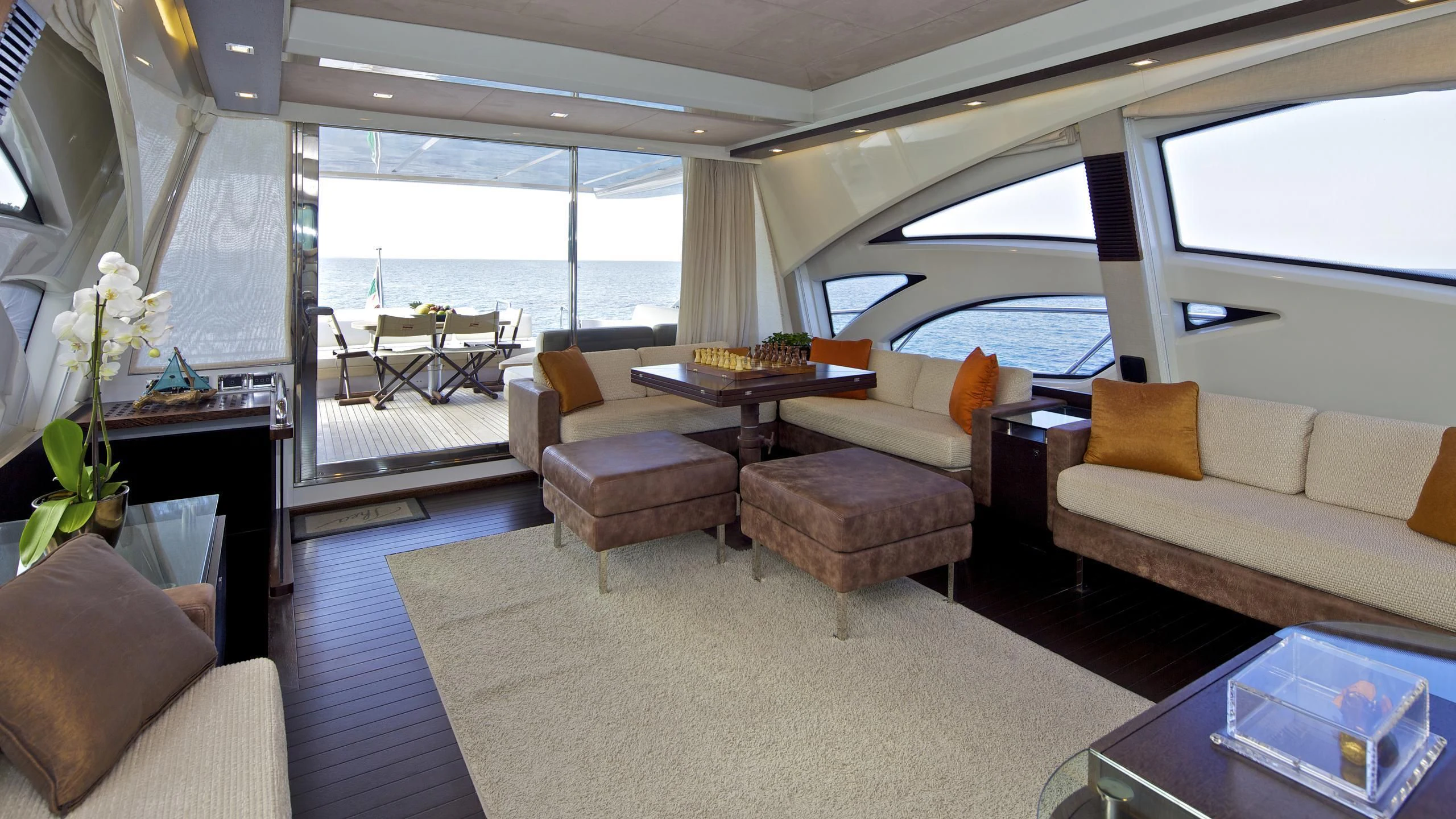 a living room with a large window aboard THEA MALTA Yacht for Sale