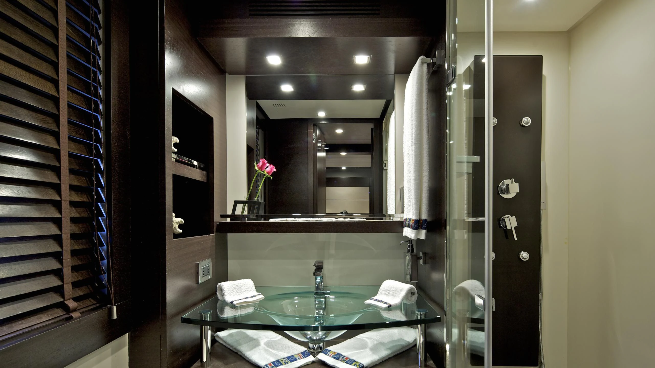 a bathroom with a large mirror aboard THEA MALTA Yacht for Sale