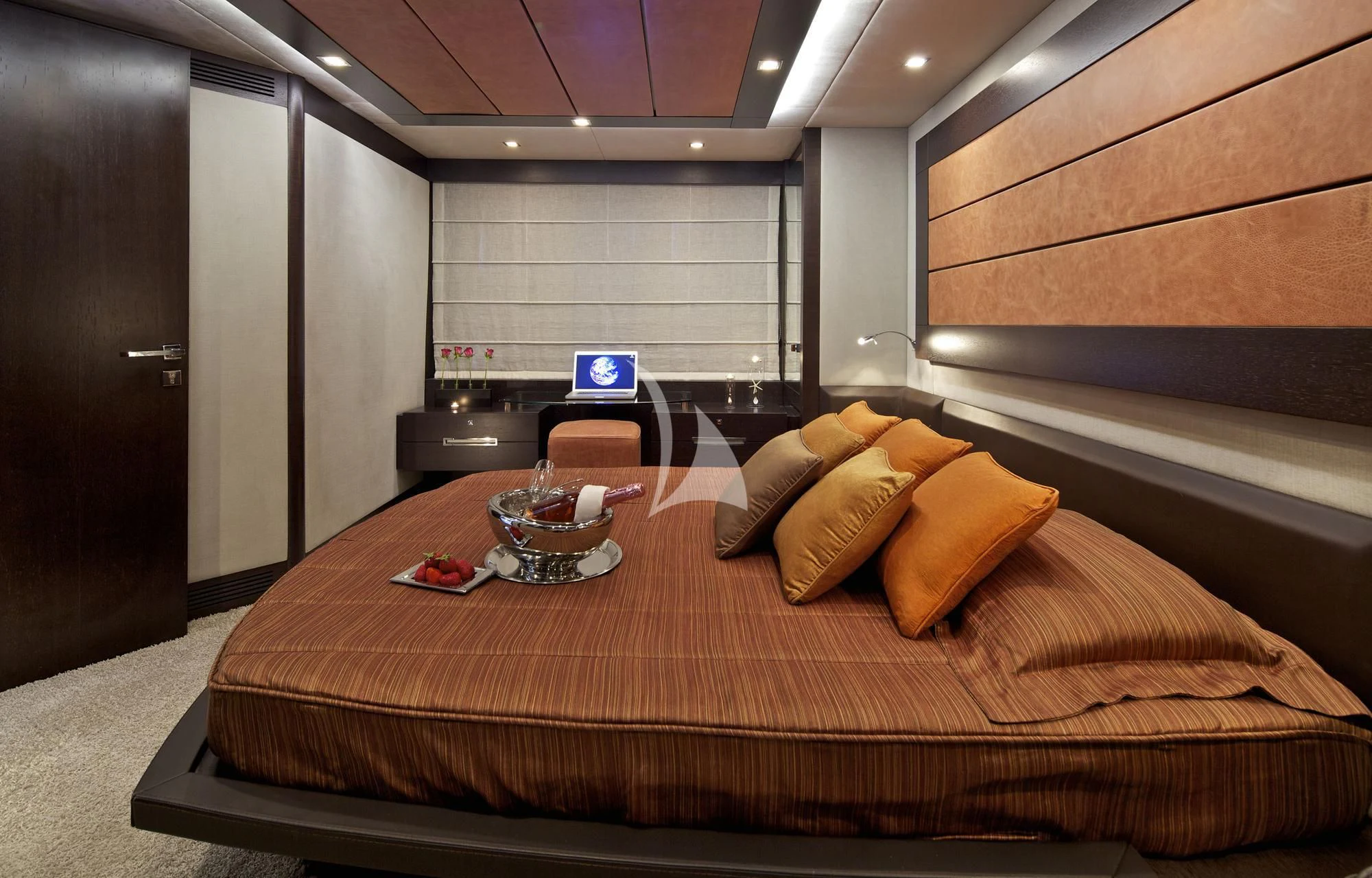 a bed with a tray of food on it aboard THEA MALTA Yacht for Sale