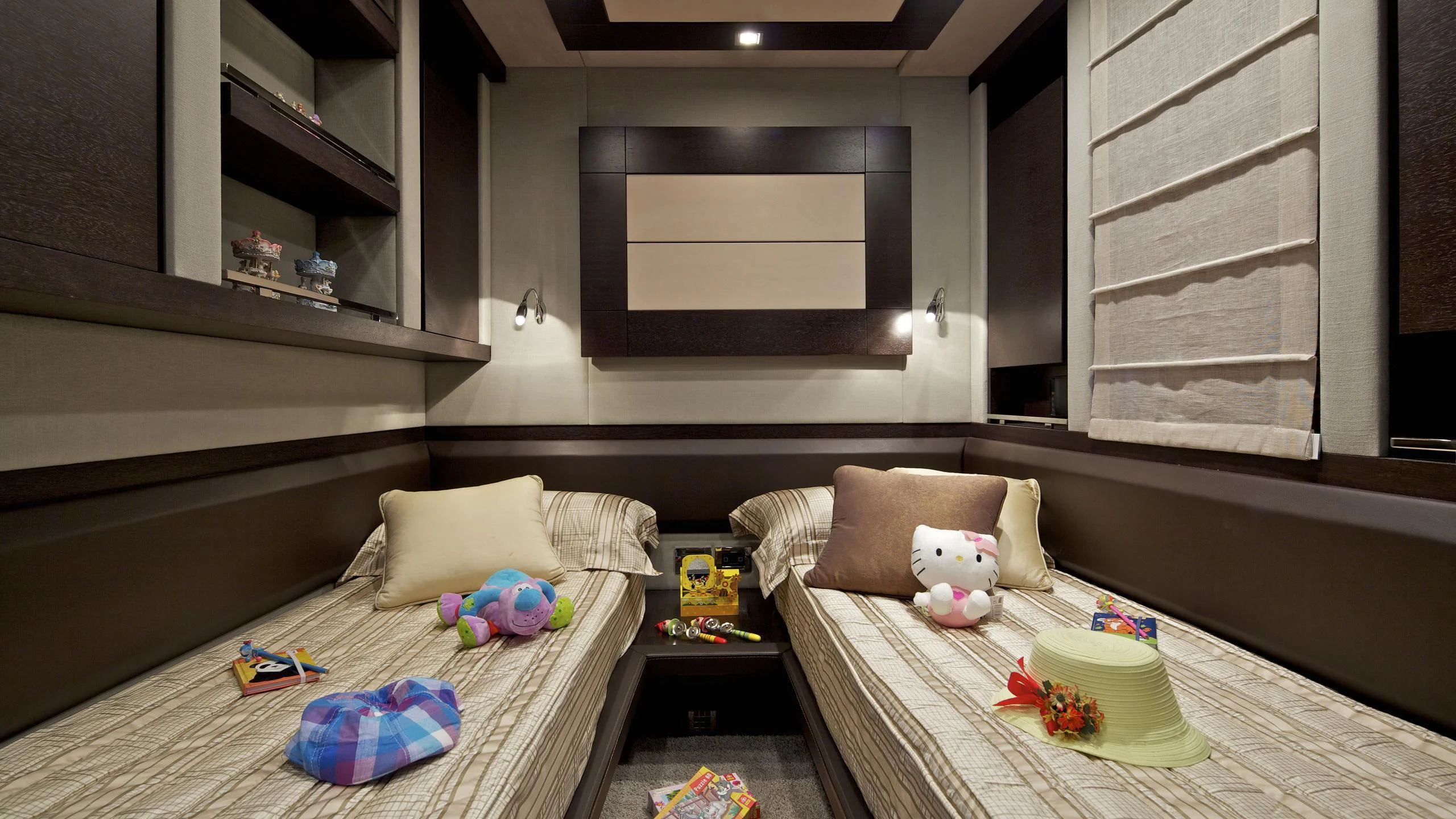 a bedroom with a bed and a plush toy aboard THEA MALTA Yacht for Sale