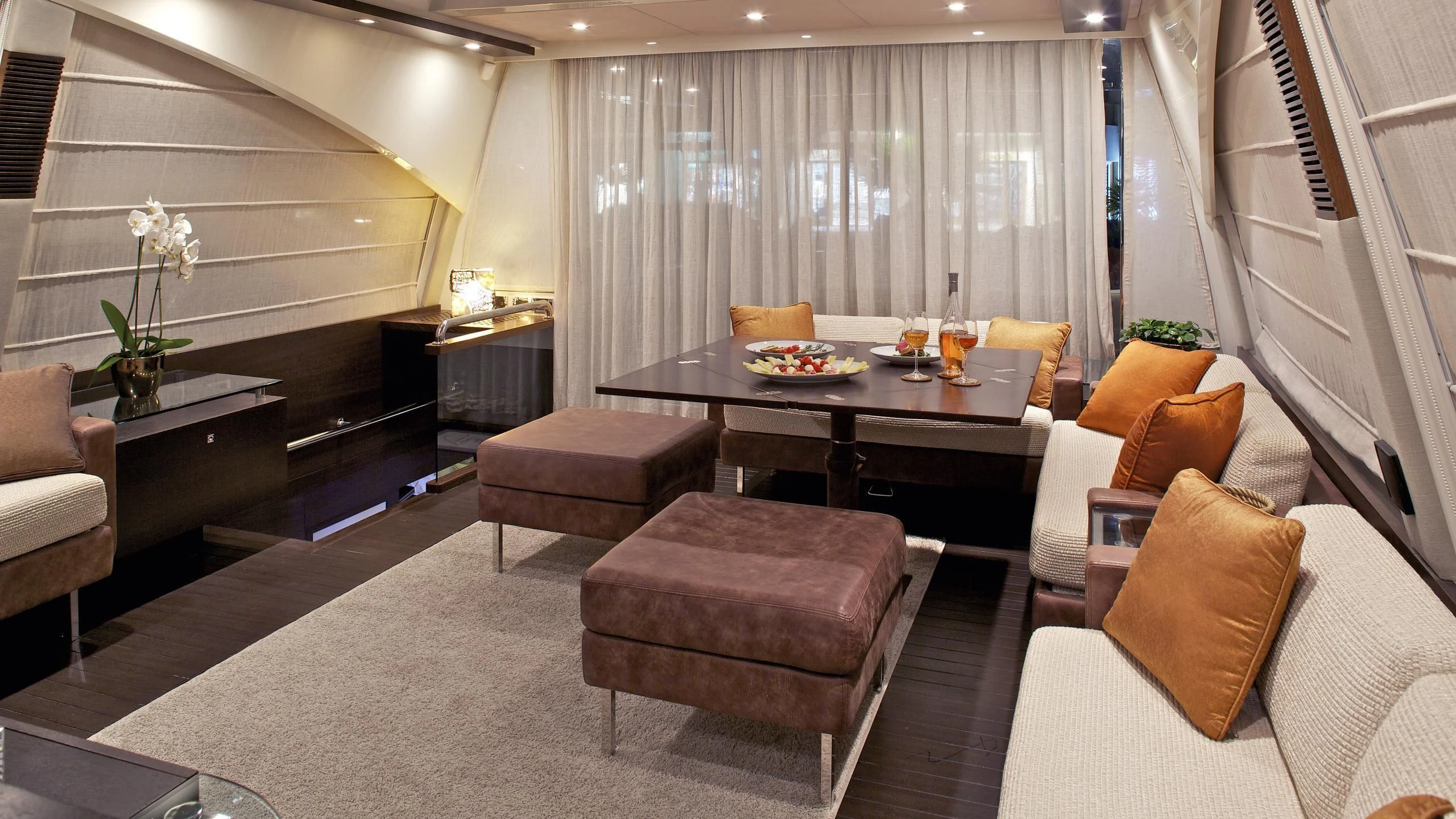 a room with a table chairs and a piano aboard THEA MALTA Yacht for Sale