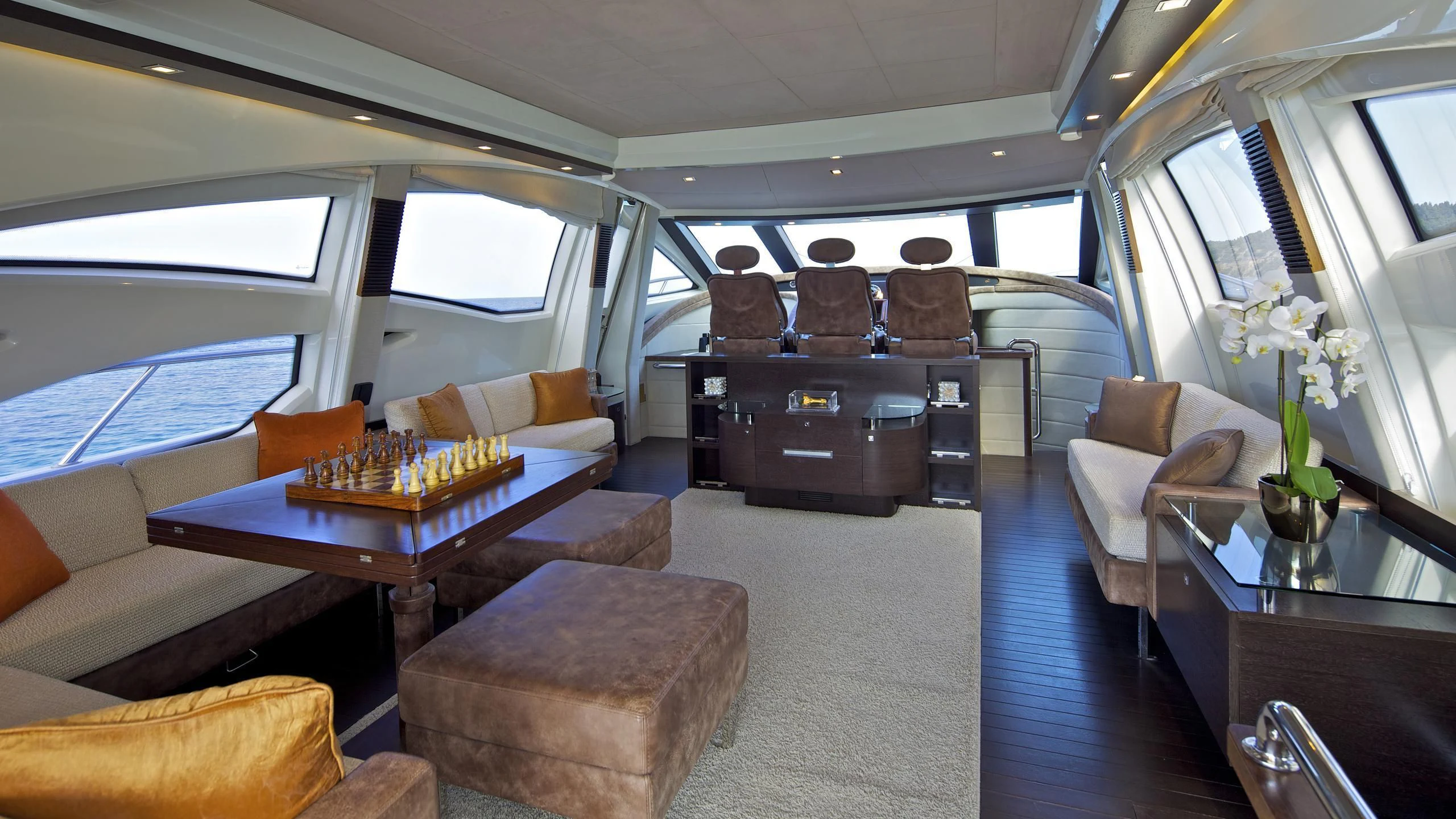a living room with a couch and a table aboard THEA MALTA Yacht for Sale