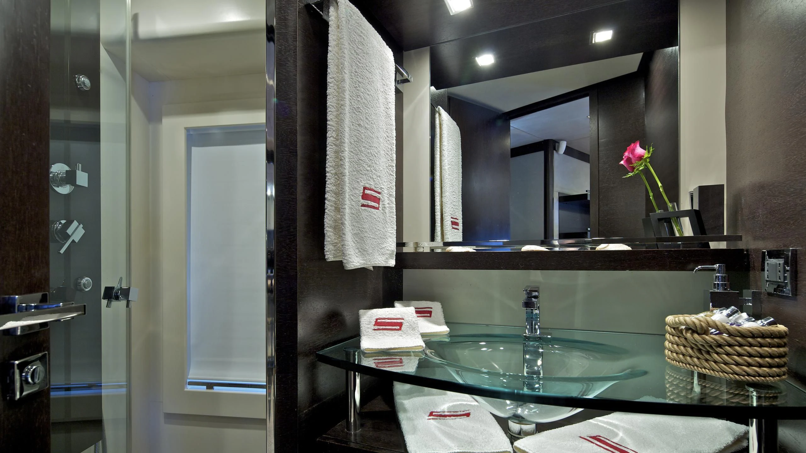 a bathroom with a countertop sink and a mirror aboard THEA MALTA Yacht for Sale