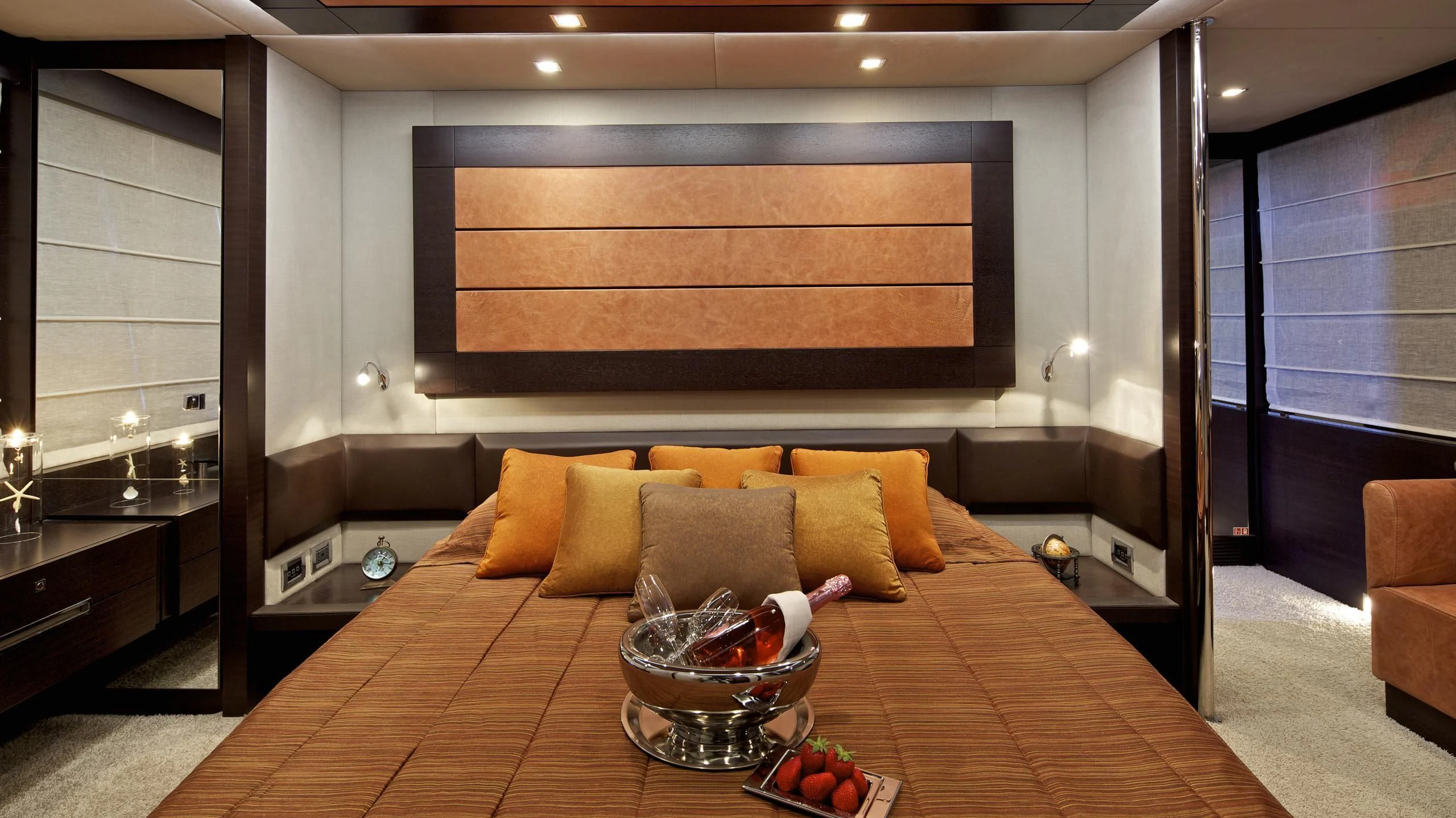 a room with a couch and a table with fruit on it aboard THEA MALTA Yacht for Sale