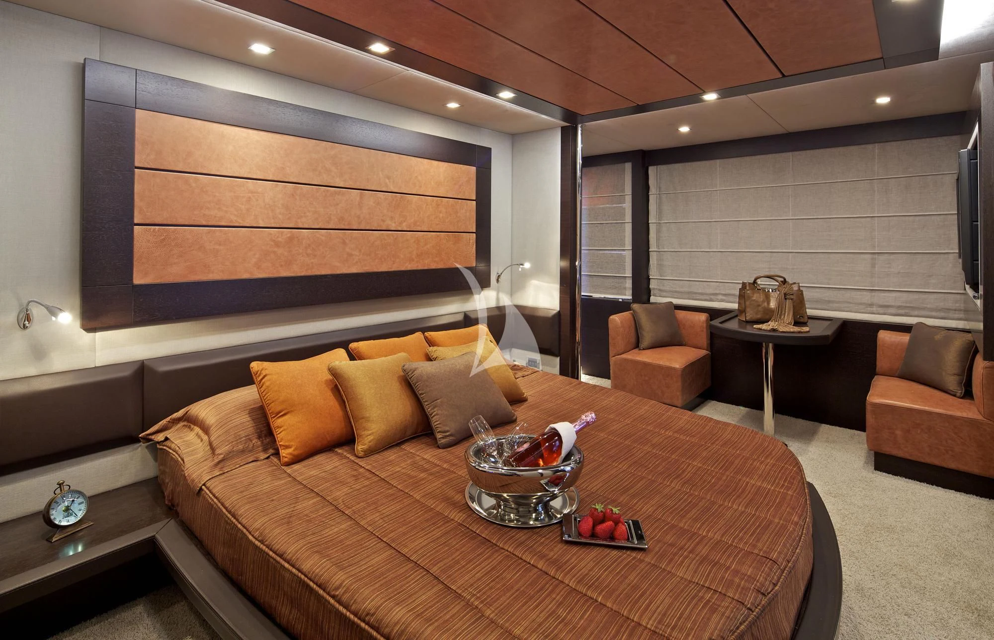 a living room with a large couch and a coffee table aboard THEA MALTA Yacht for Sale
