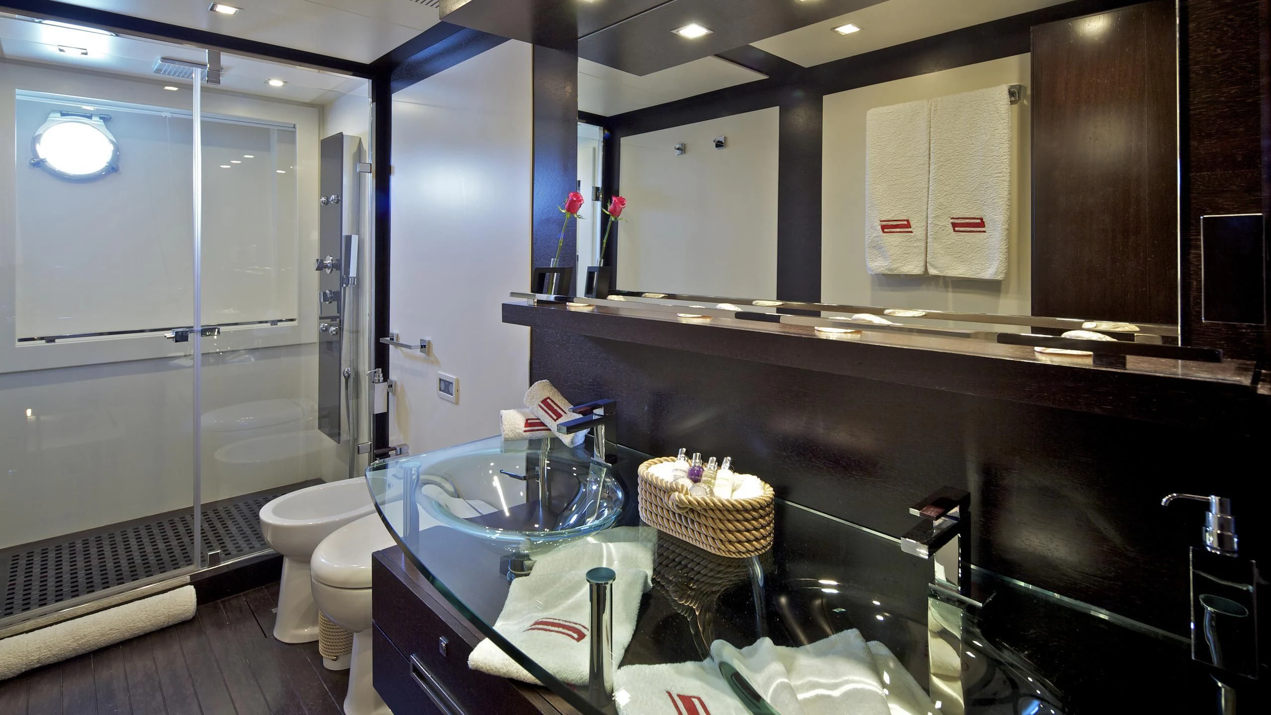 a bathroom with a sink and a mirror aboard THEA MALTA Yacht for Sale