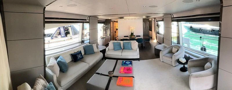 a large living room with a large window aboard KALA Yacht for Sale