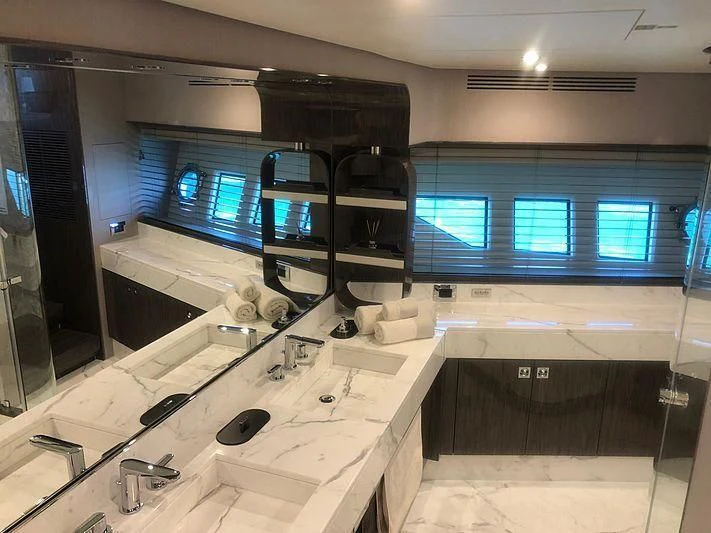 a large kitchen with a large window aboard KALA Yacht for Sale