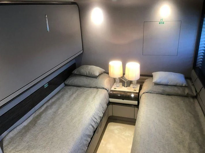 a room with two beds aboard KALA Yacht for Sale