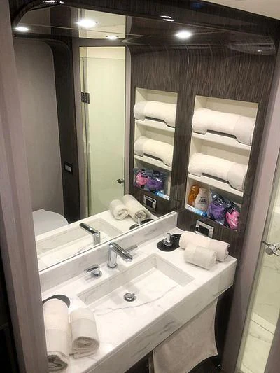 a bathroom with a large mirror aboard KALA Yacht for Sale
