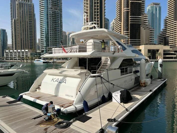 a boat docked at a pier aboard KALA Yacht for Sale