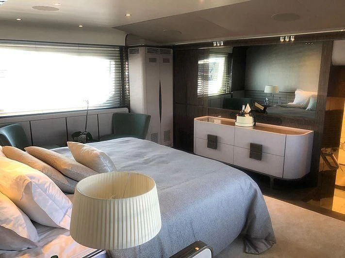 a bedroom with a large bed aboard KALA Yacht for Sale
