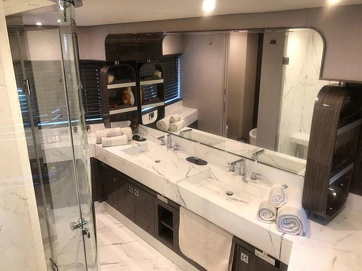 a bathroom with sinks and mirrors aboard KALA Yacht for Sale