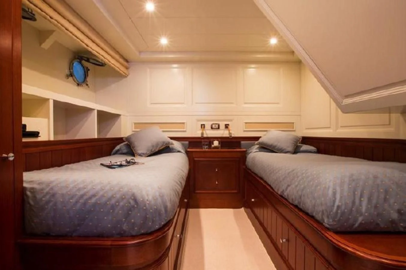 a bedroom with two beds aboard M.C. Yacht for Sale