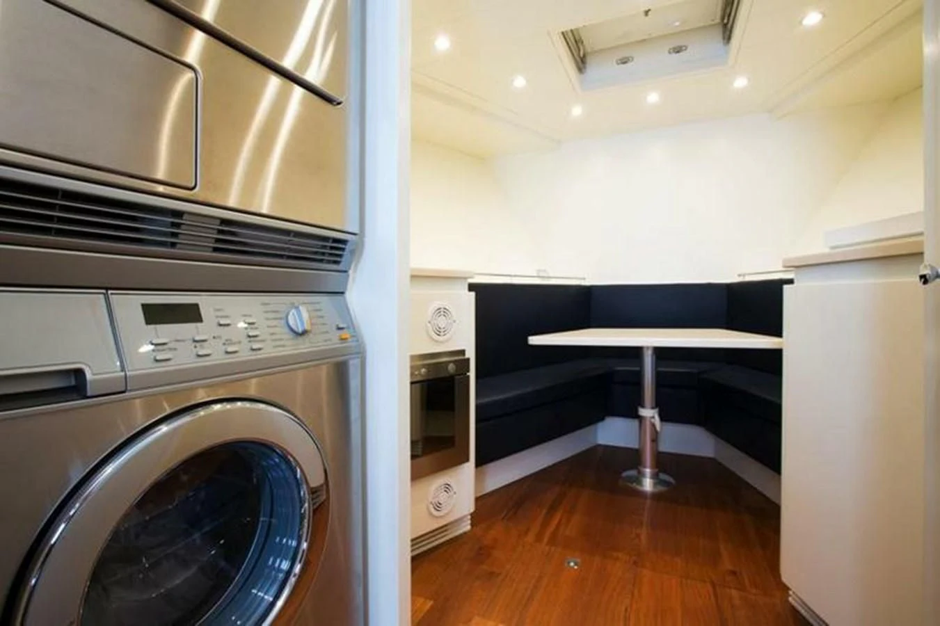 a laundry room with a washing machine aboard M.C. Yacht for Sale