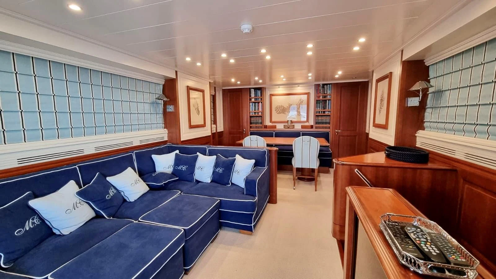 a room with a bed and a desk aboard M.C. Yacht for Sale