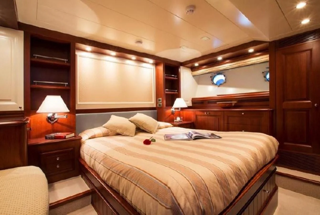 a bed in a room aboard M.C. Yacht for Sale