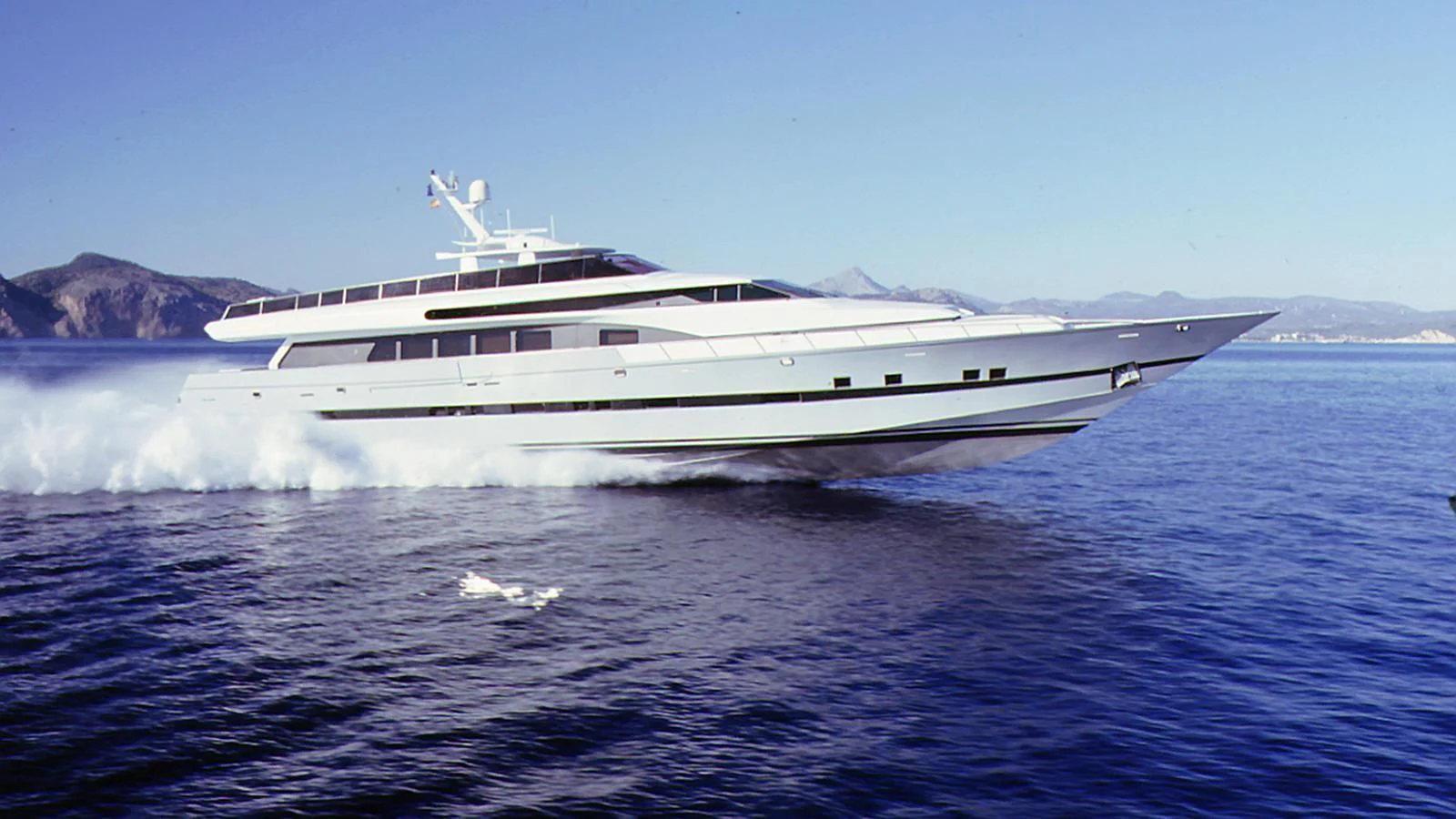 a large white boat on water aboard FONERS Yacht for Sale